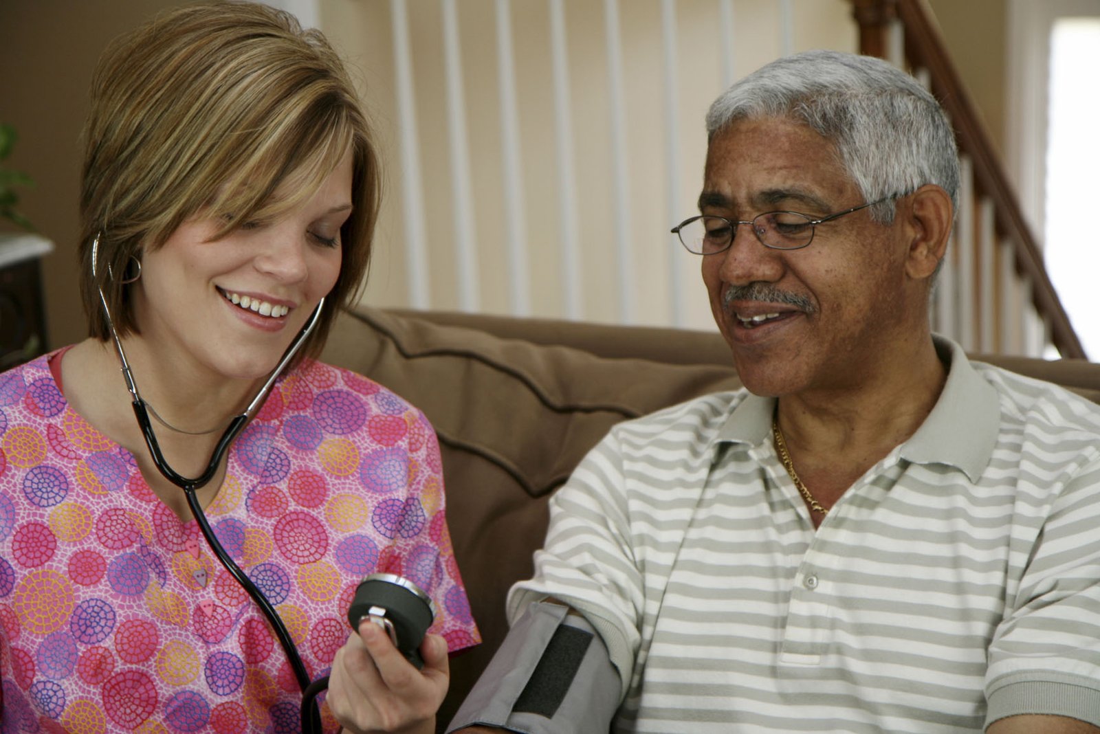 Image of a healthcare professional checking someone's blood pressure