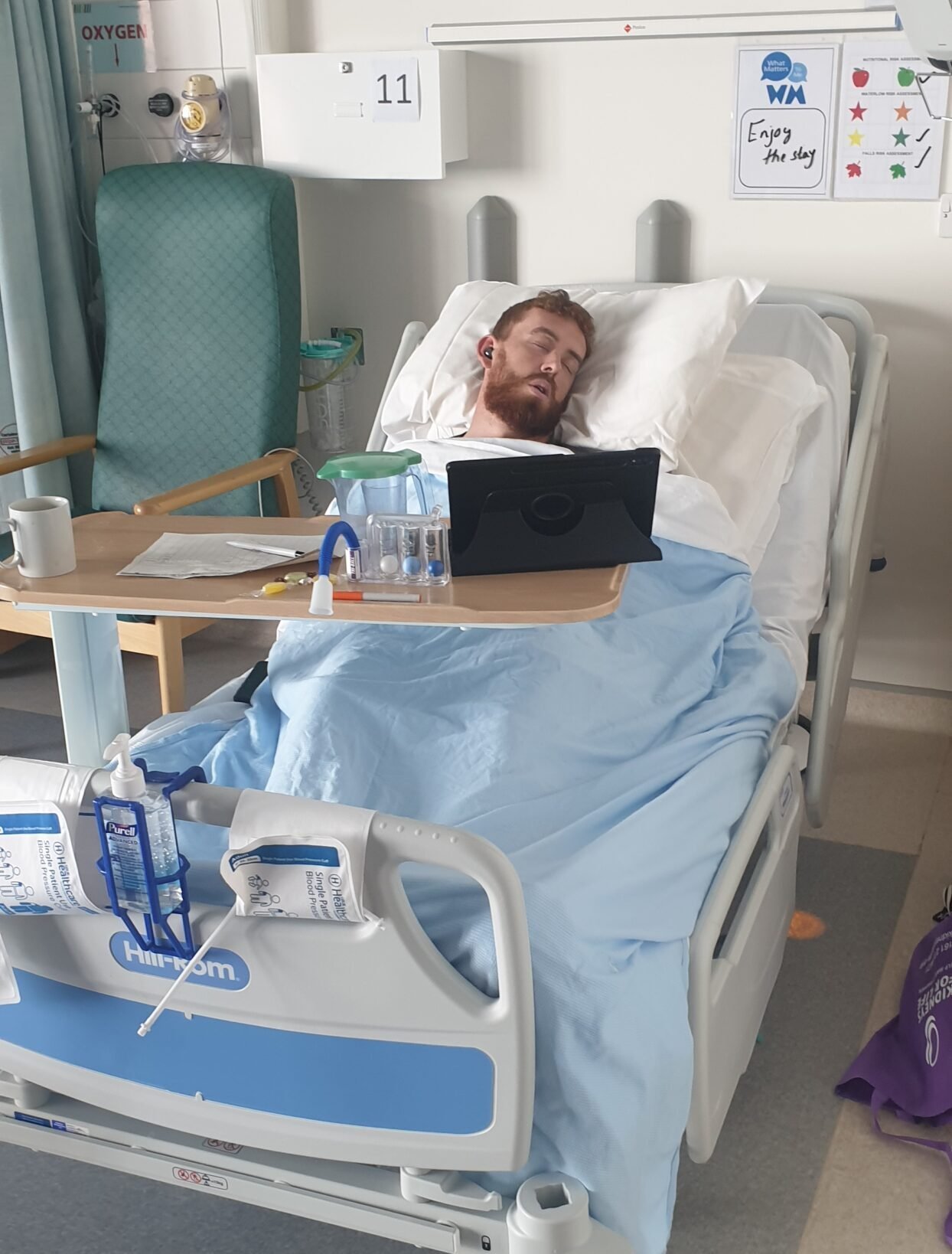 Living kidney recipient Will asleep in a hospital bed