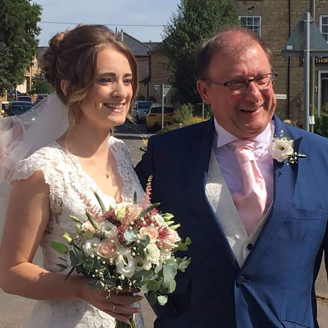 Image of Kathryn with her dad on her wedding day